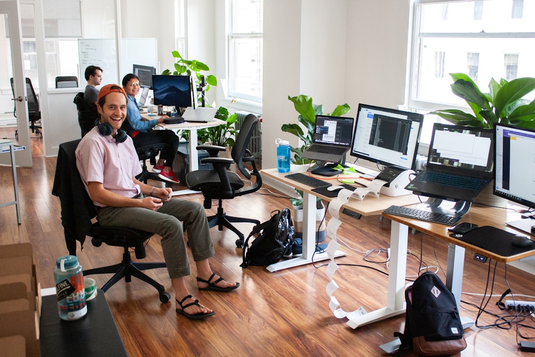 man-in-blue-dress-shirt-sitting-on-black-office-rolling-chair-ziq30tcncwk